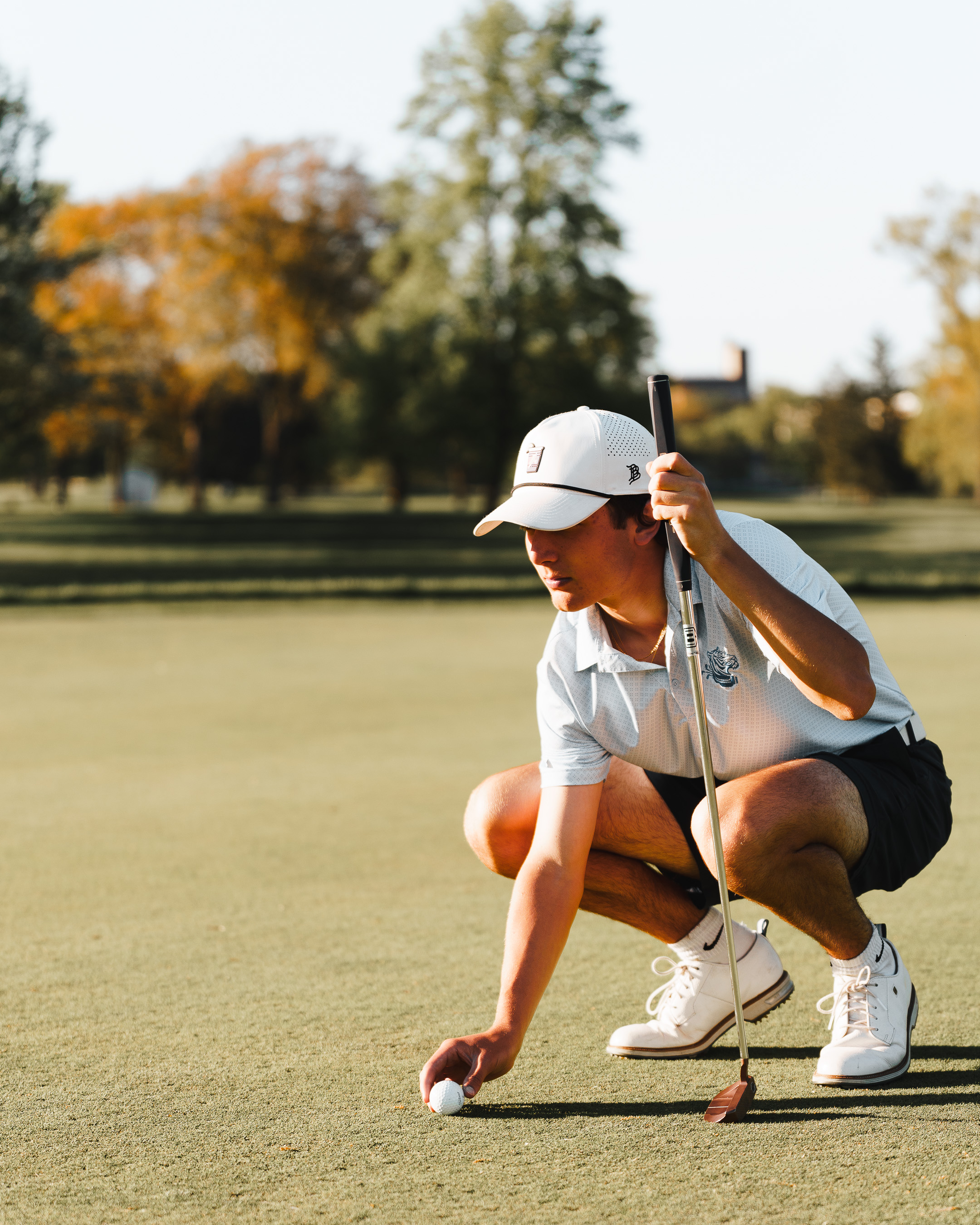 Golfer crouching